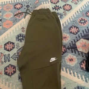 Size M Nike green athletic pants.